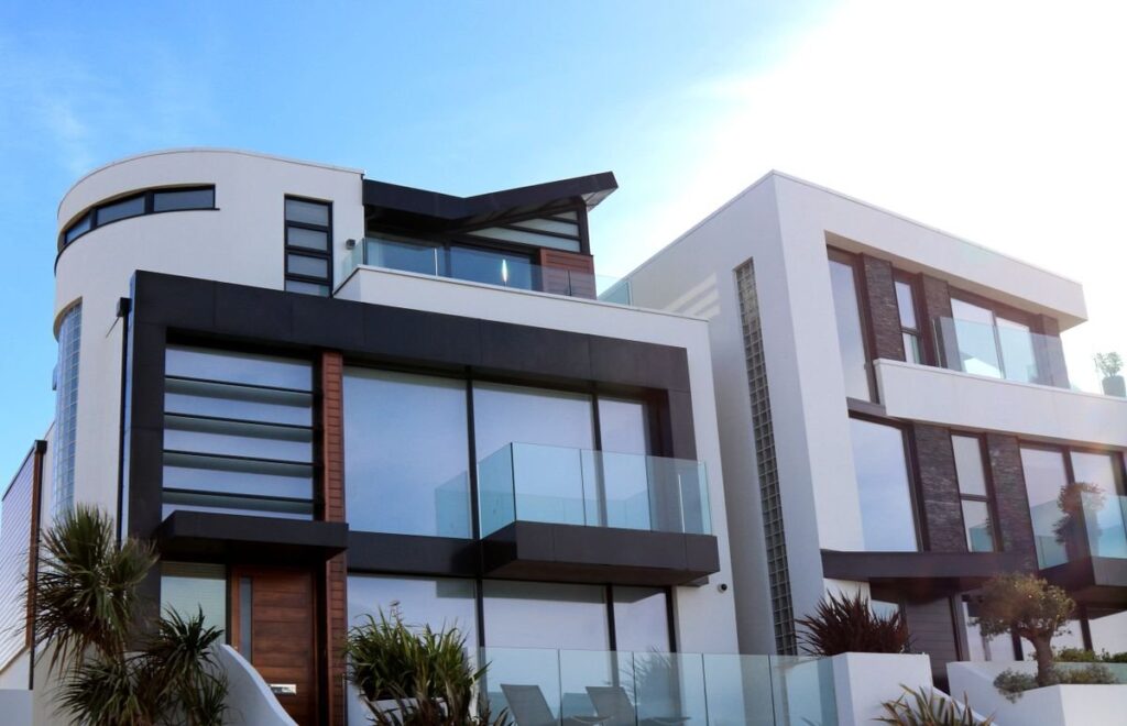 Modern two-story homes recently on the market, illustrating a home sale and the capital gains it can trigger